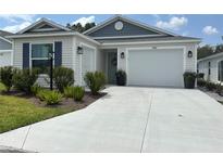 Charming single-story home with a well-manicured lawn and two-car garage, providing great curb appeal at 680 Joseph Way, The Villages, FL 34762