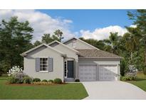 Charming single-story home with a two-car garage, landscaped yard, and a welcoming entrance at 2168 Axel St, Minneola, FL 34715