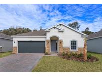 Charming single-story home with a well-manicured lawn and stone accents, offering great curb appeal at 5045 Balsam Falls Rd, Deland, FL 32724
