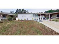 Charming single-story home with a covered carport and a well-maintained front yard at 1224 Lakeview Dr, Clermont, FL 34711