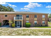 Charming brick condo with a balcony, screened porch, and well-maintained landscaping at 2423 Branch Way # 207, Maitland, FL 32751