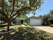 Charming single Gathering home with a well-maintained lawn and mature landscaping at 2850 Aragon Trce, Lake Mary, FL 32746