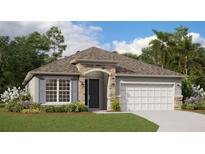 Charming single-story home with stone accents, a two-car garage, and lush landscaping at 5036 Balsam Falls Rd, Deland, FL 32724