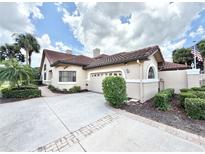 Charming single-Gathering home with a tile roof, well-maintained landscaping, and a spacious driveway at 26612 Bella Vista Dr, Howey In The Hills, FL 34737