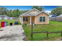 Charming single-story home featuring a quaint front porch and tidy landscaping on a sunny day at 6710 Winkles St, Coleman, FL 33521