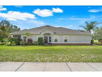 Beautiful single-story home with well-manicured lawn and lush landscaping at 3550 Fairwaters Ct # D, Clermont, FL 34711