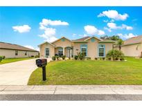 Charming single story home with a well-maintained lawn and decorative landscaping in a quiet neighborhood at 11215 Se 172Nd Place, Summerfield, FL 34491