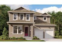 Charming two-story home boasts a welcoming front porch and a convenient two-car garage at 10100 Ballast Dr, Orlando, FL 32827