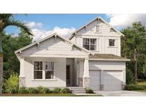 Charming two-story home boasting elegant architectural details and a well-manicured front yard at 10114 Ballast Dr, Orlando, FL 32827