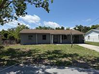 Charming single-story home with a well-maintained lawn and classic architectural design at 1109 Willow Ct, Tavares, FL 32778