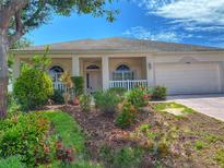 Charming single-story home with a well-manicured front yard and attached two-car garage, located in a lovely neighborhood at 3555 Chapel Hill Blvd, Clermont, FL 34711