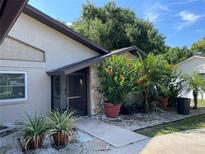 Inviting front entrance with stone accents and decorative landscaping, showcasing curb appeal at 721 Mendoza Dr, Orlando, FL 32825