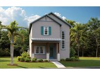 Charming two-story home with light gray facade, aqua trim, and a welcoming front porch at 1065 Peebles St, Orlando, FL 32827