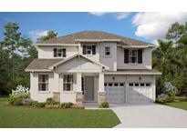 Charming two-story home with stone accents, white siding, and a well-manicured lawn at 2153 Axel St, Minneola, FL 34715