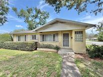 Charming single-story home with a well-maintained front yard and walkway leading to the entrance at 2237 Washington Rd, Mount Dora, FL 32757