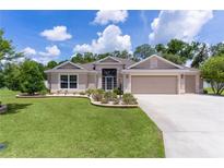 Charming one-story home with well-manicured lawn and inviting curb appeal at 2954 Heiny Pl, The Villages, FL 32163