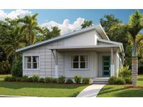 Charming single-story home featuring a modern design, covered entry, and well-maintained landscaping at 9811 Peebles St, Orlando, FL 32827