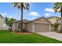 Charming single-Gathering home with well-manicured lawn and mature palm trees at 15169 Harrowgate Way, Winter Garden, FL 34787