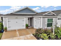 Charming single-story home with two-car garage and manicured landscaping enhancing the curb appeal at 6342 Whittle Ct, The Villages, FL 32163