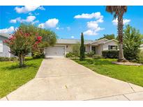 Charming single story home featuring a well manicured front yard and inviting curb appeal at 1224 Ballesteros Dr, The Villages, FL 32162