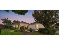 Beautiful single story home with a well-manicured lawn and mature landscaping in a desirable community at 12947 Se 97Th Terrace Rd, Summerfield, FL 34491