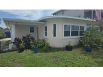 Charming single-story home featuring a stucco exterior, well-kept landscaping, and bright windows at 498 Golf Blvd, Daytona Beach, FL 32118