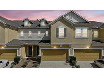 Charming townhome with well-maintained landscaping and a two-car garage at 17439 Promenade Dr, Clermont, FL 34711
