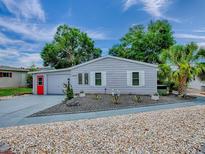 Charming single-story home with a well-maintained yard and attractive landscaping at 25007 Bellevue, Leesburg, FL 34748