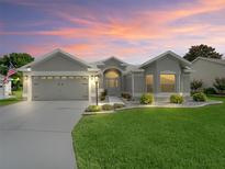 Charming single-story home with a well-manicured lawn and a beautifully landscaped front yard, perfect for curb appeal at 3057 Saint Thomas Ln, The Villages, FL 32162