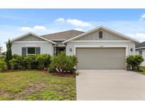 Charming single-story home with well-manicured landscaping and neutral color palette at 3260 Casa Del Rey Ave, Kissimmee, FL 34746