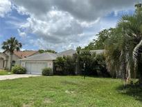 Charming single-story home with a two-car garage and mature landscaping at 5268 Sw 110Th Pl, Ocala, FL 34476