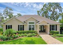 Charming single-story home featuring a well-manicured front yard and inviting entryway at 6136 Lake Emma Rd, Groveland, FL 34736