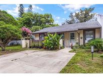 Charming single-story home with a well-manicured lawn and a cozy front entrance at 3015 Casselwood St, Winter Park, FL 32792