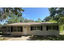 Charming single-story home featuring a well-maintained front yard and classic architecture at 11651 Fairmont Ave, Leesburg, FL 34788