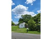Cozy home featuring a mailbox with a clear view of the structure and lush surrounding landscape at 2611 Hiawatha Ave, Sanford, FL 32773