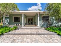 Charming home featuring a stone pathway leading to a covered front porch with classic columns at 32511 County Road 437, Sorrento, FL 32776