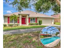 Charming single-story home featuring a red front door, red shutters, well-manicured landscaping, and a beautiful pool at 1216 Cheshire St, Groveland, FL 34736