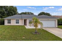 Charming single-story home featuring well-maintained landscaping and a classic design at 15349 Lafite Ln, Clermont, FL 34714