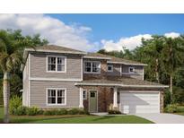 Charming two-story home featuring a mixed siding and brick exterior with an attached two car garage at 2952 Garden Trail Bnd, St Cloud, FL 34771