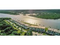 Waterfront condos offering serene views and access to waterfront activities in a landscaped community with mature trees at 14 Ocean Palm Villa S # 14, Flagler Beach, FL 32136