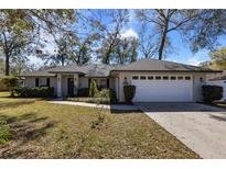 Charming single-story home featuring a well-maintained lawn and a two-car garage at 1762 Ne 39Th St, Ocala, FL 34479
