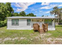 Charming single story home featuring a new metal roof, freshly painted siding and a cozy front porch at 21776 Nw 57Th Ave, Micanopy, FL 32667