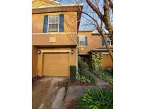 Charming townhome featuring a well-maintained front exterior and an attached single-car garage at 3875 Shaftbury Pl, Oviedo, FL 32765