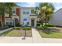 Charming townhome featuring well-maintained landscaping and convenient accessible parking space at 4426 Sw 49Th Ave, Ocala, FL 34474