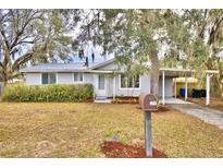 Cute ranch home with carport and mature landscaping at 337 Swingle St, Frostproof, FL 33843