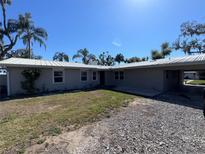 Charming single-story home with a metal roof, a large yard, and a convenient carport at 1893 N Lake Reedy Blvd, Frostproof, FL 33843