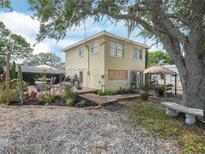 Lovely home featuring a spacious backyard with deck, seating and mature landscaping at 1351 Smokey Rd, Lake Wales, FL 33859