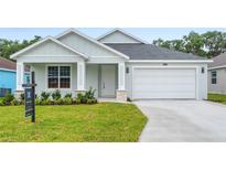 Charming single-Gathering home with a well-manicured lawn and a two-car garage at 4545 Fairway Oaks Dr, Mulberry, FL 33860