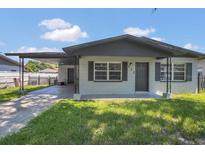 Charming single-story home with a covered carport and a well-maintained lawn at 602 Taylor Blvd, Winter Haven, FL 33880