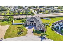 Beautiful aerial view of a landscaped single-Gathering home with a well-manicured lawn and private backyard at 3652 Frentress Dr, Lakeland, FL 33812